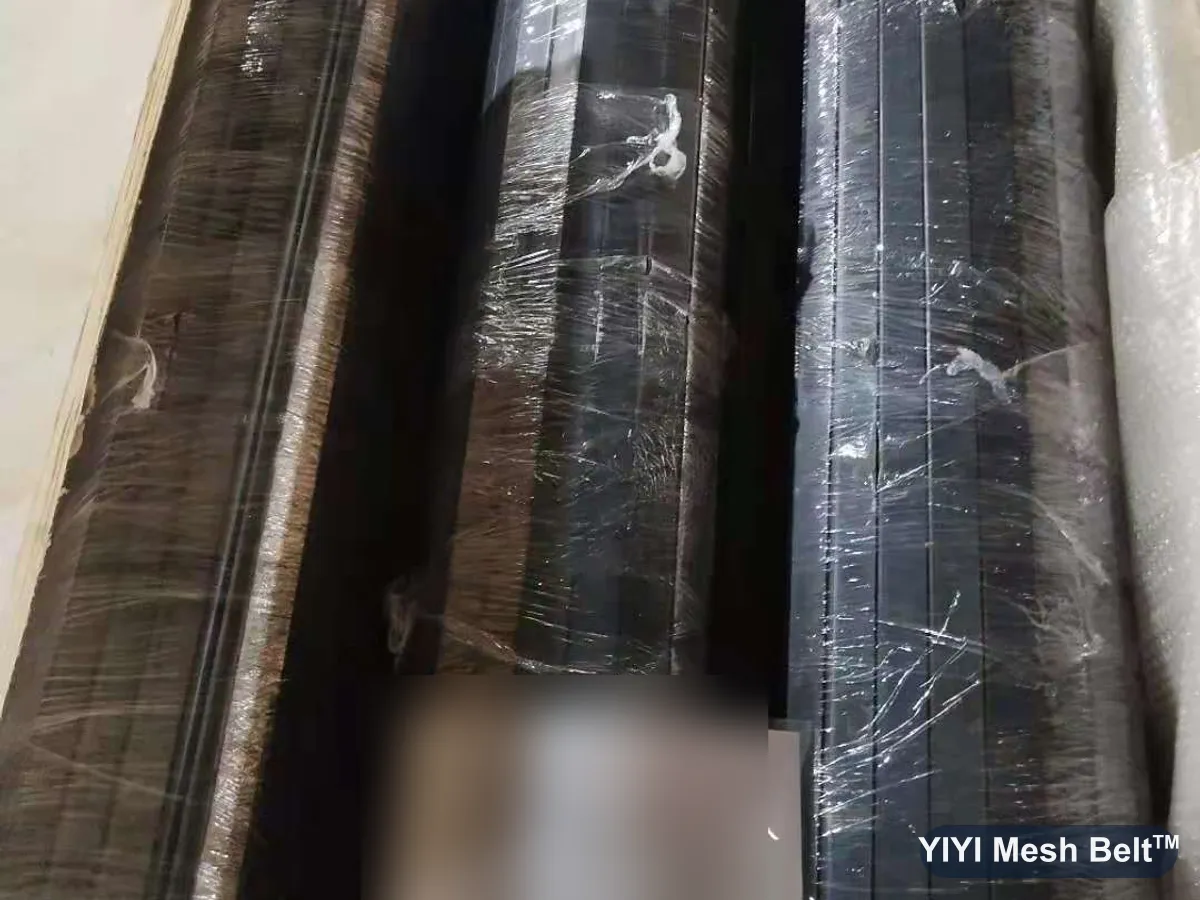 Rolled conveyor belts wrapped in waterproof film inside an export case