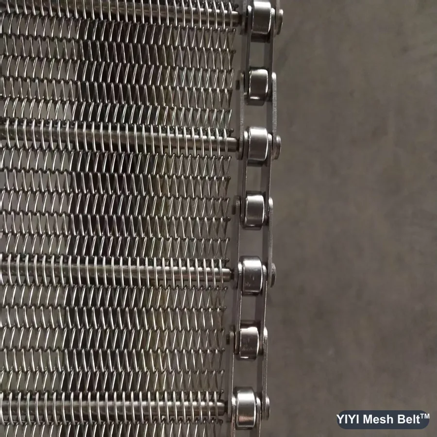 Roller chain edge of a chain driven belt for frying equipment