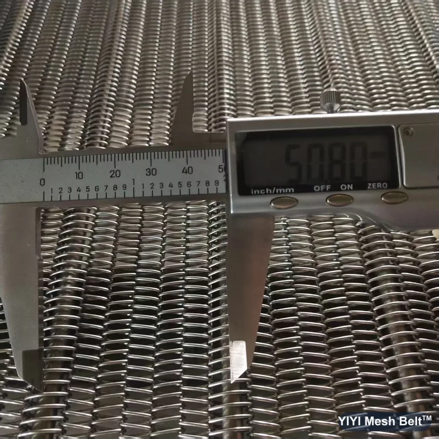 Caliper measuring 50.8 mm cross rod spacing on a chain driven belt
