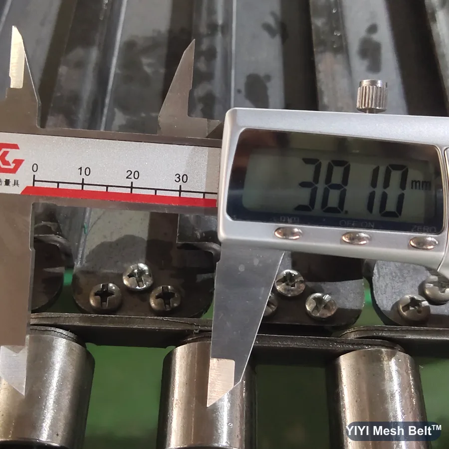 Caliper measuring 38.1 mm chain pitch on a chain plate belt