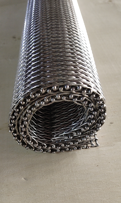 Rolled compound weave belt edge and dense mesh surface