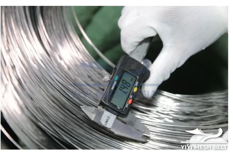 YIYI Mesh Belt stainless steel wire coil measured with a digital caliper before it is formed into self-stacking belt spirals