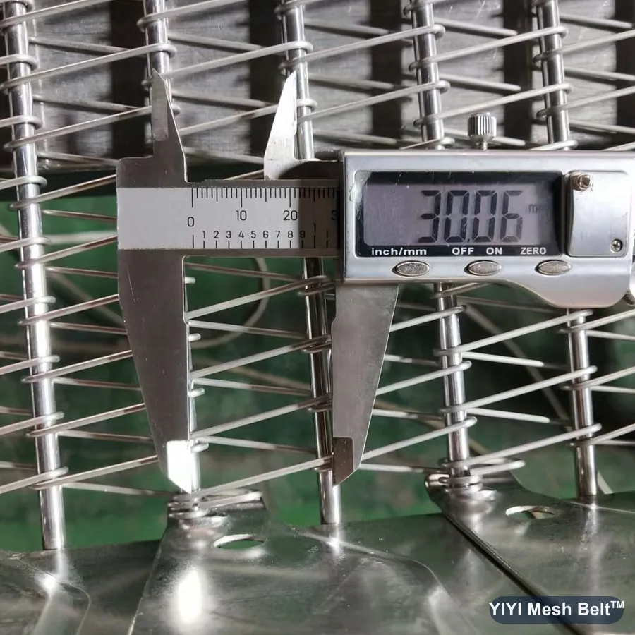 Caliper measuring a 30 mm cross rod pitch on a self-stacking belt