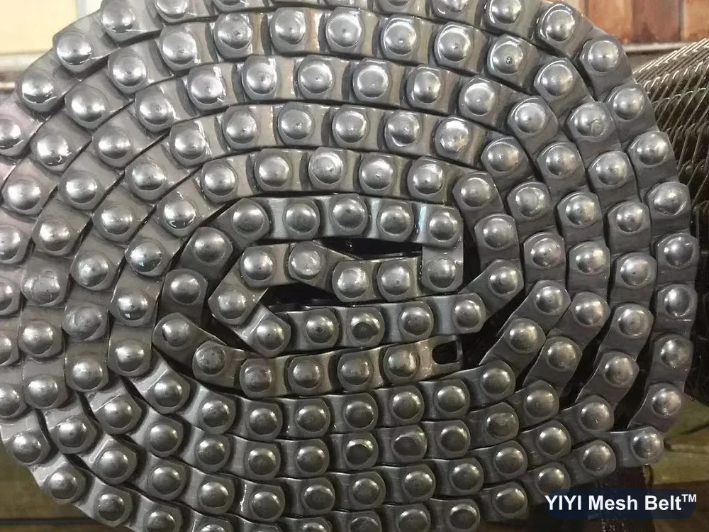 Finished chain edges of a spiral freezer belt during final inspection