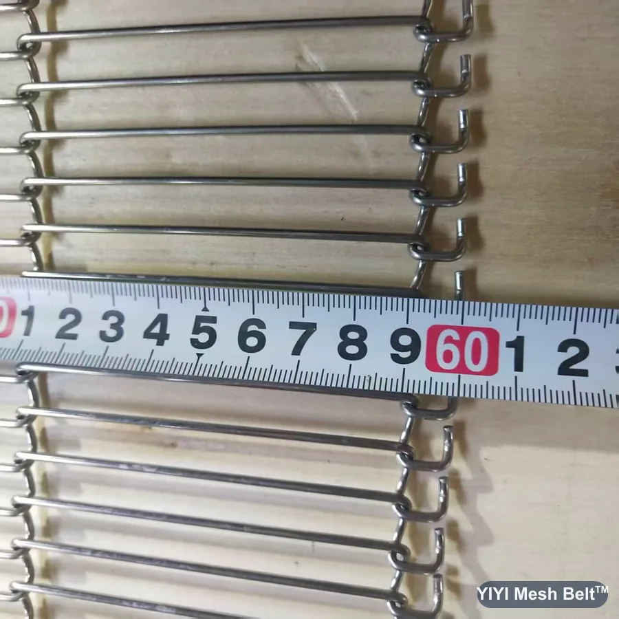 Tape measuring pitch along a trapezoidal mesh belt