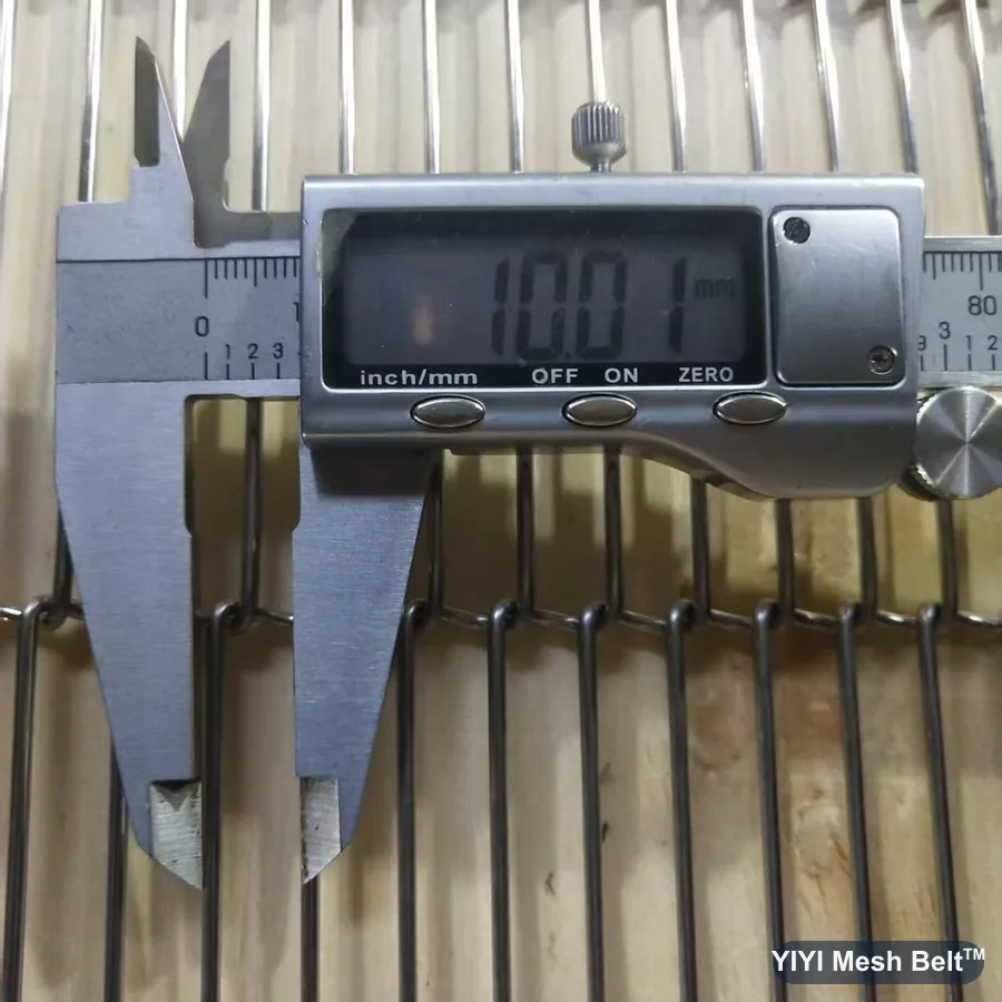 Caliper reading 10 mm pitch on a trapezoidal mesh belt sample