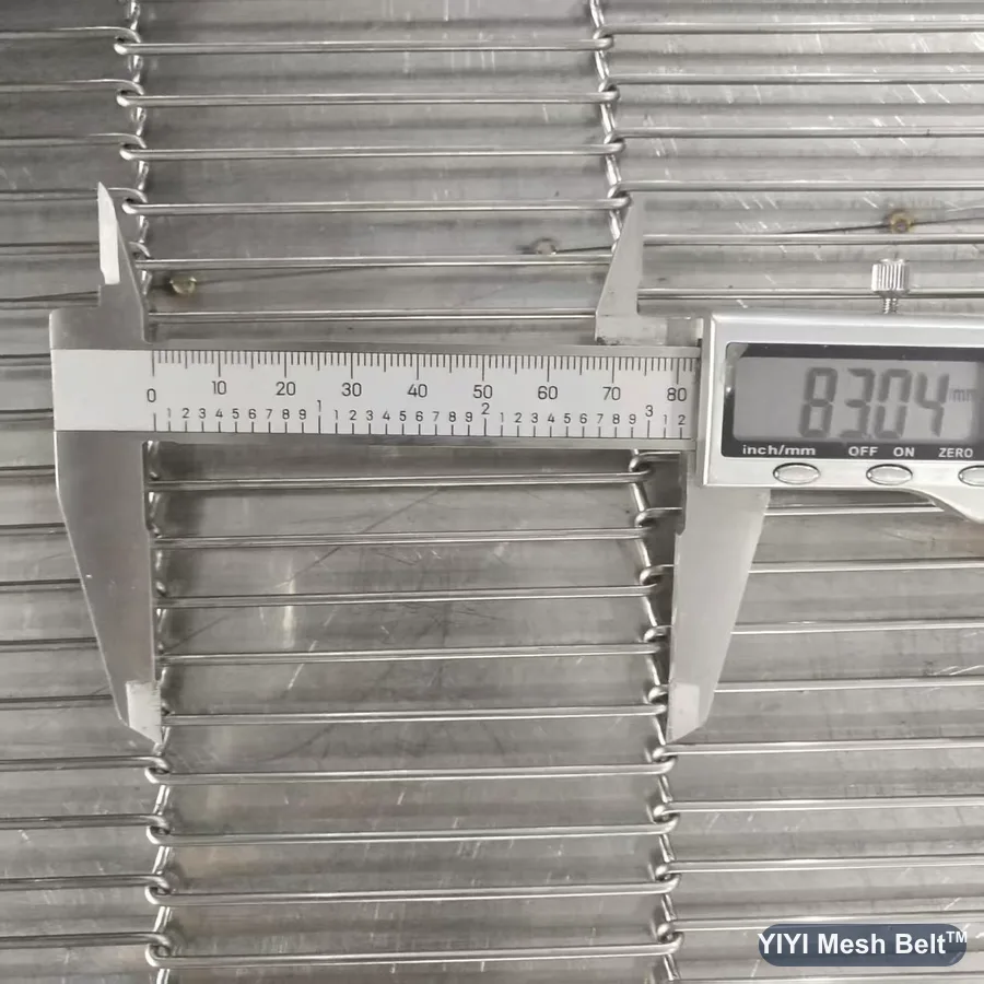Tape measuring an 83 mm space width on a trapezoidal mesh belt