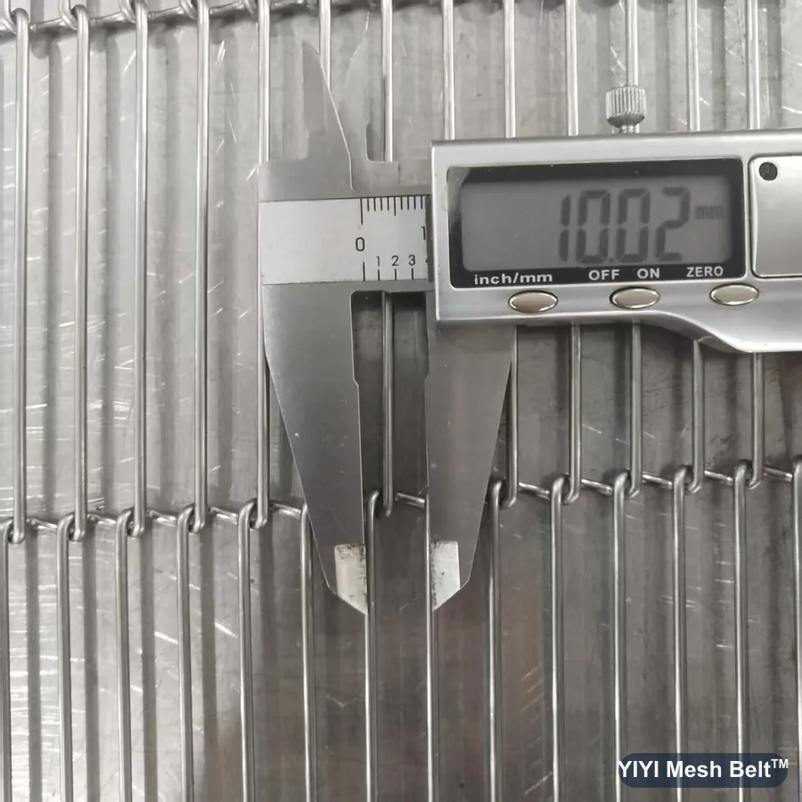Digital caliper reading 2.0 mm wire on a trapezoidal mesh belt